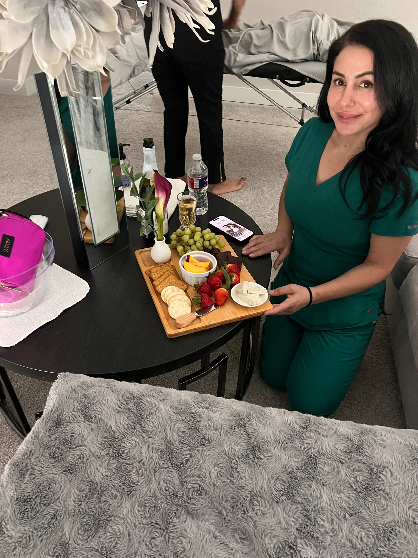 Gaya preparing a snack board for a postpartum mama